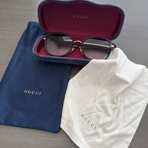 Gucci Black Frame Gradient Lens Sunglasses with Gold Accents